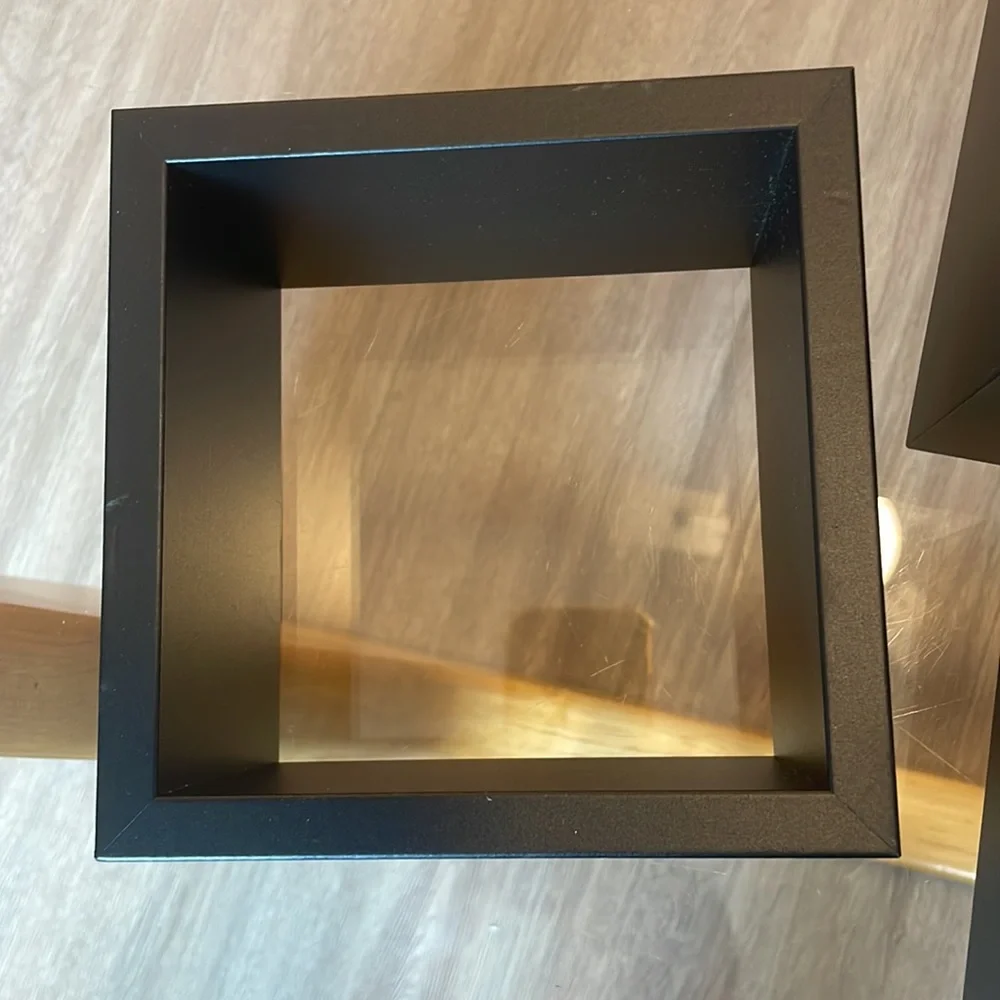 3 black shelving units